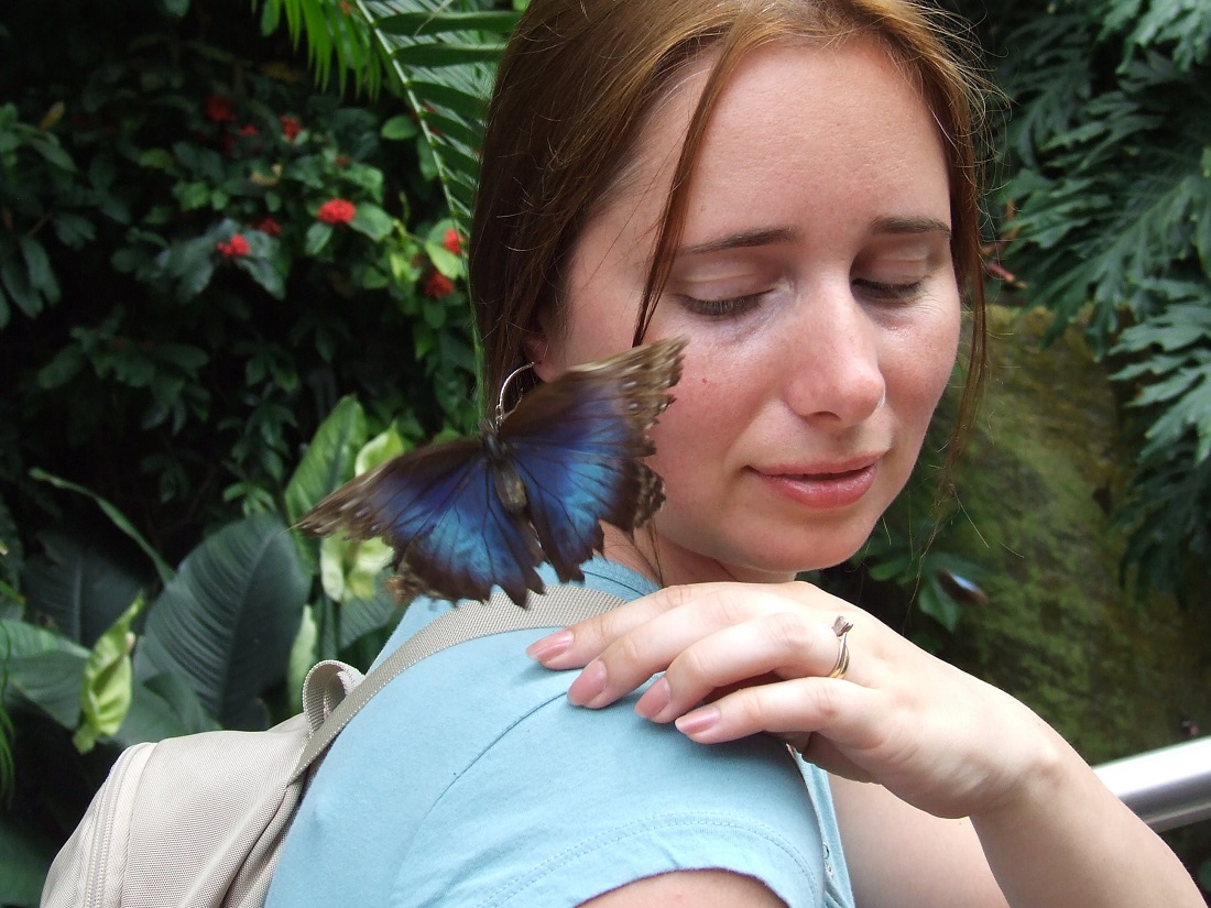 Elena with large butterfly on shoulder